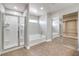 Bathroom with walk-in shower, tub, and mirrored closet at 260 Pioneers Peak, Henderson, NV 89002