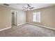 Bedroom featuring plush carpeting, a ceiling fan, and a window with blinds at 260 Pioneers Peak, Henderson, NV 89002