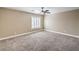 Bedroom with carpet, ceiling fan, and window with bright natural light at 260 Pioneers Peak, Henderson, NV 89002