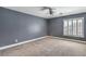 Bedroom with a ceiling fan, plush carpet and a window with plantation shutters at 260 Pioneers Peak, Henderson, NV 89002