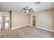 This bedroom features neutral walls, carpet flooring, a modern ceiling fan, and a walk-in closet at 260 Pioneers Peak, Henderson, NV 89002