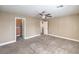 Bedroom with a ceiling fan, carpeted floor, and neutral color scheme at 260 Pioneers Peak, Henderson, NV 89002