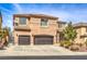 Stunning two-story house with tile roof, desert landscaping and a spacious two-car garage at 260 Pioneers Peak, Henderson, NV 89002