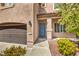 Inviting front entryway with a blue door, stone accents, and desert landscaping at 260 Pioneers Peak, Henderson, NV 89002