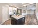 Kitchen with stainless appliances and a dark center island at 260 Pioneers Peak, Henderson, NV 89002