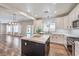 Modern kitchen featuring a large island, stainless steel appliances, and ample cabinet space at 260 Pioneers Peak, Henderson, NV 89002