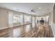 Expansive living room with hardwood floors, lots of natural light, and view into the kitchen at 260 Pioneers Peak, Henderson, NV 89002