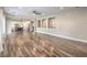 Spacious living room with hardwood flooring and an open layout leading into the kitchen at 260 Pioneers Peak, Henderson, NV 89002