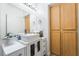 Bright bathroom featuring a modern vanity, stylish sink, and a wooden cabinet at 2615 W Gary Ave # 1089, Las Vegas, NV 89123