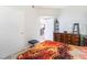 View of a bedroom featuring a patterned bedspread and classic wooden furniture at 2615 W Gary Ave # 1089, Las Vegas, NV 89123