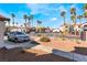 Charming neighborhood street view with lush landscaping, palm trees, and parked cars at 2615 W Gary Ave # 1089, Las Vegas, NV 89123