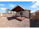 Cozy backyard featuring a covered patio, rock landscaping and brick perimeter wall at 2883 Mount Hope Dr, Las Vegas, NV 89156
