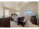 Bedroom with neutral walls, vaulted ceiling and large window offering plentiful natural light at 2883 Mount Hope Dr, Las Vegas, NV 89156