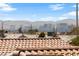 Enjoy stunning city views from this home featuring red tiled roofing and an incredible view of the Las Vegas skyline at 2883 Mount Hope Dr, Las Vegas, NV 89156