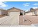 Charming single-story home featuring a two-car garage, desert landscaping, and a neutral color palette at 2883 Mount Hope Dr, Las Vegas, NV 89156