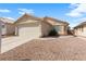 Single-story home with a two-car garage and desert landscaping for low maintenance at 2883 Mount Hope Dr, Las Vegas, NV 89156