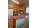 Well-lit kitchen features wooden cabinets and modern appliances set against a neutral color scheme at 2883 Mount Hope Dr, Las Vegas, NV 89156