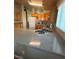 Kitchen featuring wood cabinets, ample counter space, and sleek, stainless steel fixtures at 2883 Mount Hope Dr, Las Vegas, NV 89156