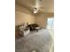 Comfortable living room featuring carpet floors, vaulted ceilings, and a ceiling fan at 2883 Mount Hope Dr, Las Vegas, NV 89156