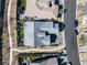 Aerial view showcasing home's layout, backyard with pool and outdoor seating, and proximity to nearby street at 2931 Raywood Ash Dr, Las Vegas, NV 89138