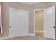 Bedroom with a double closet and open door to the next room at 2931 Raywood Ash Dr, Las Vegas, NV 89138