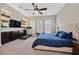 Spacious bedroom with a plush bed, built-in shelving, and a sunny window view at 2931 Raywood Ash Dr, Las Vegas, NV 89138