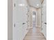 Hallway featuring closet doors and hardwood floors, offering both storage and style at 2931 Raywood Ash Dr, Las Vegas, NV 89138