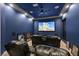 Home theater featuring comfortable leather seating, a large screen, and surround sound at 2931 Raywood Ash Dr, Las Vegas, NV 89138