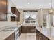 Gourmet kitchen featuring gas cooktop, granite countertops and under mount sink at 2931 Raywood Ash Dr, Las Vegas, NV 89138