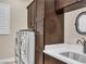 This is a well-organized laundry area with modern washer and dryer, cabinetry, sink and countertop space at 2931 Raywood Ash Dr, Las Vegas, NV 89138