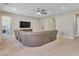 Spacious living room features a large sectional, recessed lights, and backyard view at 2931 Raywood Ash Dr, Las Vegas, NV 89138