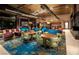 Elegant clubhouse lounge area with stylish seating, cozy fireplace, and vibrant decor at 2931 Raywood Ash Dr, Las Vegas, NV 89138