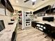 Bright home office featuring custom shelving, multiple workstations and modern decor at 2931 Raywood Ash Dr, Las Vegas, NV 89138