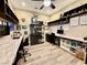 Home office boasts custom shelving, dual workstations and modern lighting at 2931 Raywood Ash Dr, Las Vegas, NV 89138