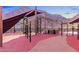 Vibrant community playground with shade structures and soft, colorful surfacing, set against a mountain view at 2931 Raywood Ash Dr, Las Vegas, NV 89138