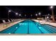 Resort-style swimming pool with lounge chairs and well-lit surroundings at 2931 Raywood Ash Dr, Las Vegas, NV 89138