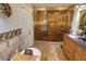 Bathroom featuring a large glass shower, a soaking tub, and a vanity at 3132 El Camino Rd, Las Vegas, NV 89146