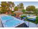 Luxurious outdoor space featuring side-by-side hot tubs and a poolside tiki hut perfect for entertaining at 3132 El Camino Rd, Las Vegas, NV 89146