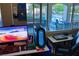 Inviting home office space with a view of the pool, creating a serene and productive work environment at 3132 El Camino Rd, Las Vegas, NV 89146