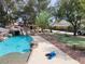 Beautiful pool with rock details and a slide, perfect for hot summer days and Gathering gatherings at 3132 El Camino Rd, Las Vegas, NV 89146