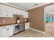 Custom bar area features white cabinetry, wood countertops, and beverage coolers at 3173 Lido Isle Ct, Las Vegas, NV 89117