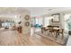 Bright, open dining room features stylish decor and access to waterfront views at 3173 Lido Isle Ct, Las Vegas, NV 89117