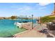 Private boat dock with a sunshade and inviting waters, perfect for lakeside living at 3173 Lido Isle Ct, Las Vegas, NV 89117