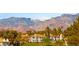 Elegant multi-story homes boast well-manicured lawns and beautiful mountain views at 3173 Lido Isle Ct, Las Vegas, NV 89117