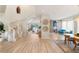 Spacious foyer with a winding staircase, wood-look floors, and an open floor plan to the kitchen and living area at 3173 Lido Isle Ct, Las Vegas, NV 89117