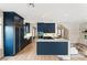 Gourmet kitchen with custom blue cabinetry, stainless steel appliances, and a center island at 3173 Lido Isle Ct, Las Vegas, NV 89117