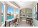 Bright home office boasts a desk, shelves, and a large window overlooking the water at 3173 Lido Isle Ct, Las Vegas, NV 89117