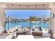 Relaxing covered patio showcases comfortable seating and serene lake views at 3173 Lido Isle Ct, Las Vegas, NV 89117