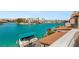 Overhead view from balcony showing neighborhood waterfront featuring a covered boat, water, and distant mountains at 3173 Lido Isle Ct, Las Vegas, NV 89117