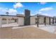View of backyard featuring a spacious covered patio, chimney, and ample space for outdoor activities at 3228 Robin Cir, Las Vegas, NV 89121